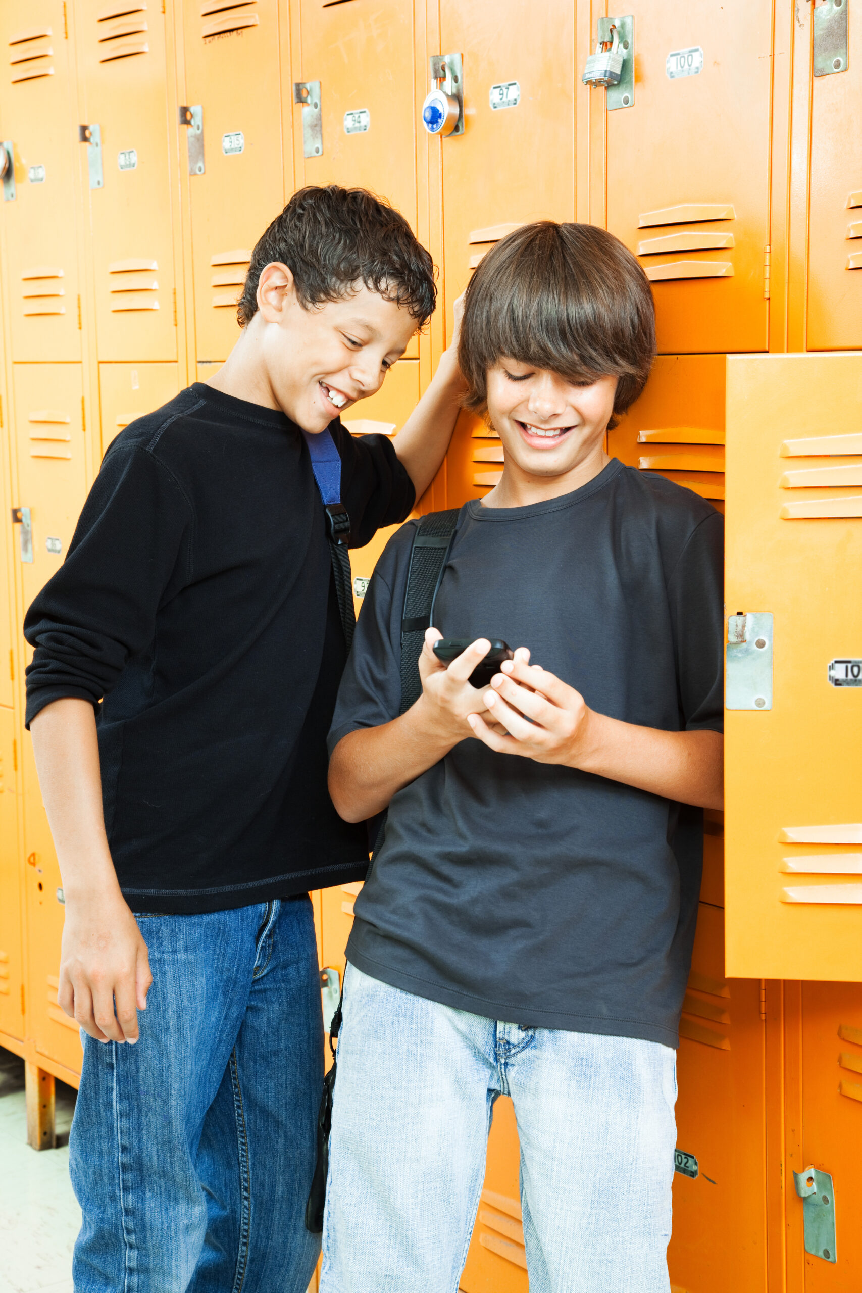 Teenage,Boys,Playing,Video,Games,Between,Classes,In,School.